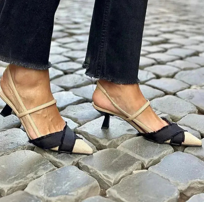 Apricot and black colour block women's stiletto heel sandals with a buckle fastening and pointed toe.