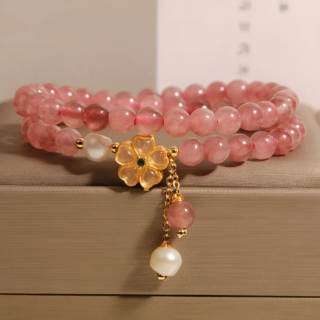 Women's double ring bracelet with a strawberry quartz twin four-leaf clover design.