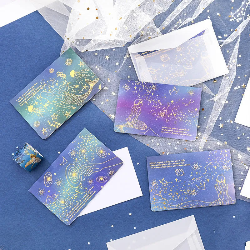 Set of three bronzing finish folding greeting card envelopes in four colour styles, measuring 13cm by 8.5cm.