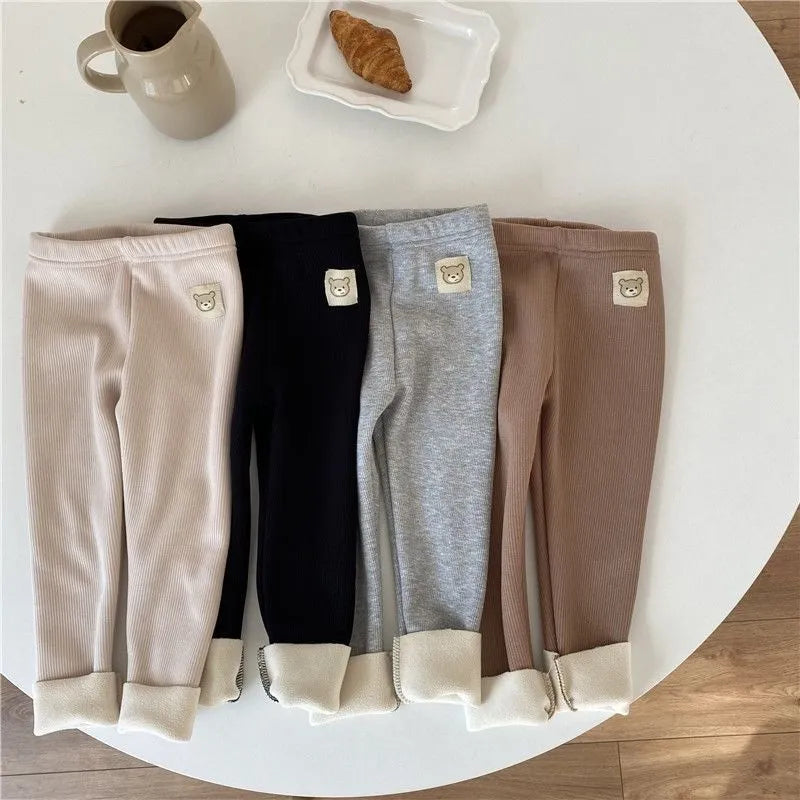 Girl's high-waist fleece-lined winter leggings in solid colour with wool lining and hair band belt.