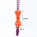 Small green bone-shaped rope knot dog toy with porous openings for treats
