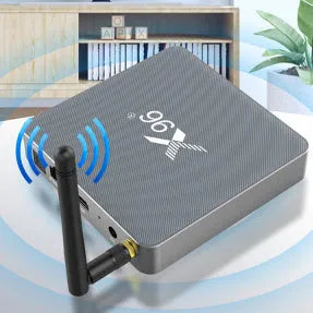 Android Smart Voice Set-top Box with remote, HDMI cable, and power adapter on a table.