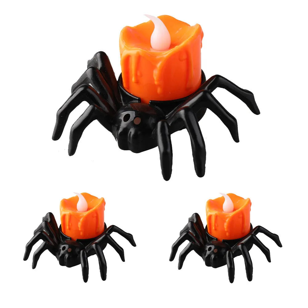 Halloween spider candlestick ornament with plastic construction and battery-powered lighting