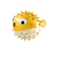 Fish shaped TPR interactive dog chew toy with treat dispensing slot and textured surface