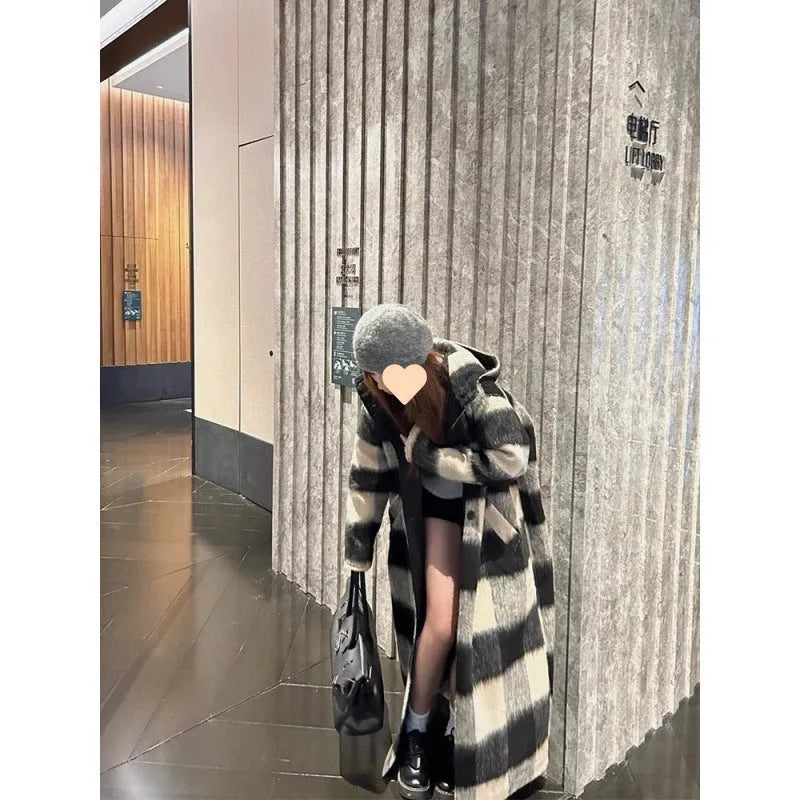 Beige and black plaid mid-length loose fit polyester women's winter woolen coat with lapel collar on a model