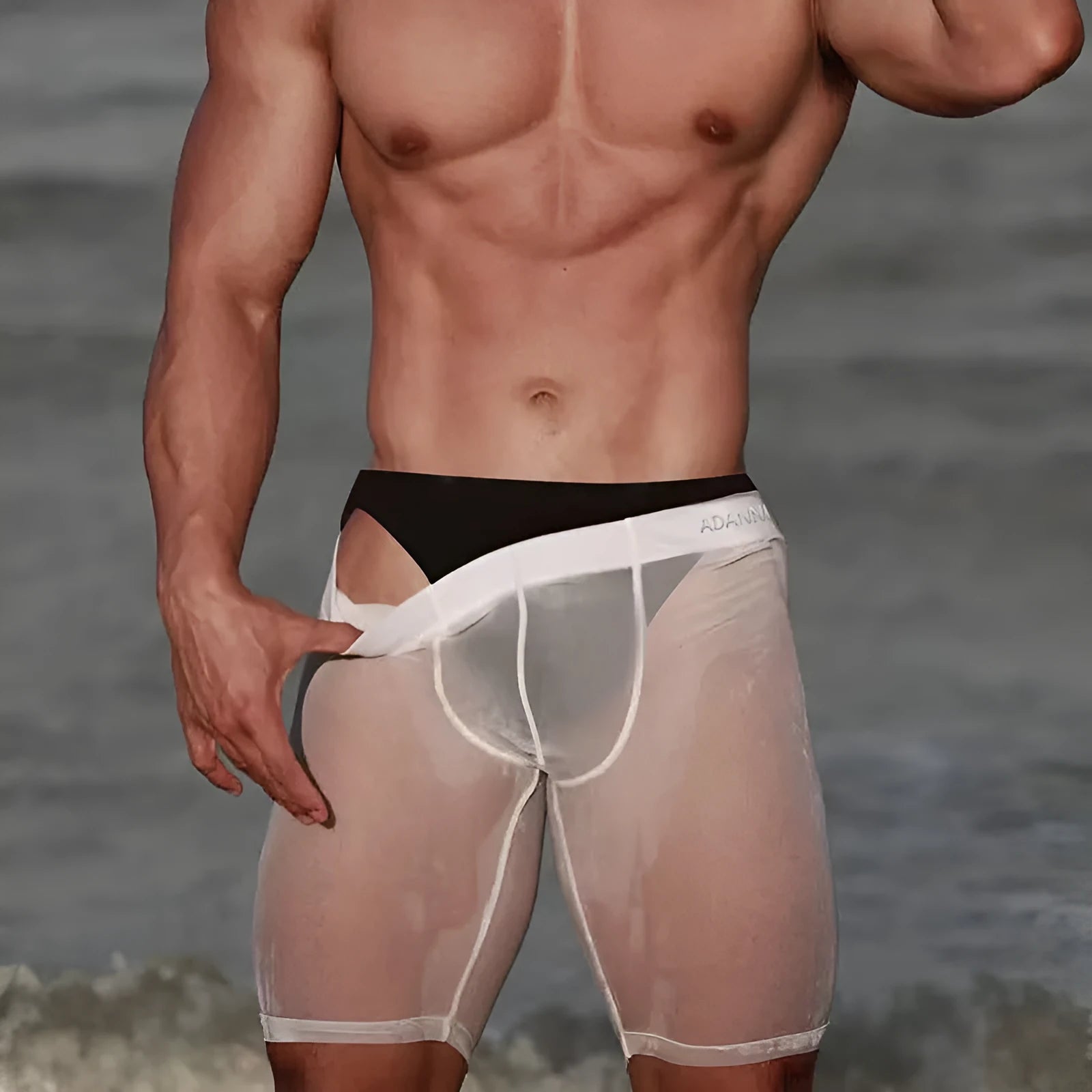 Men's black seamless mesh home shorts with knitted nylon construction and hip-lifting fit