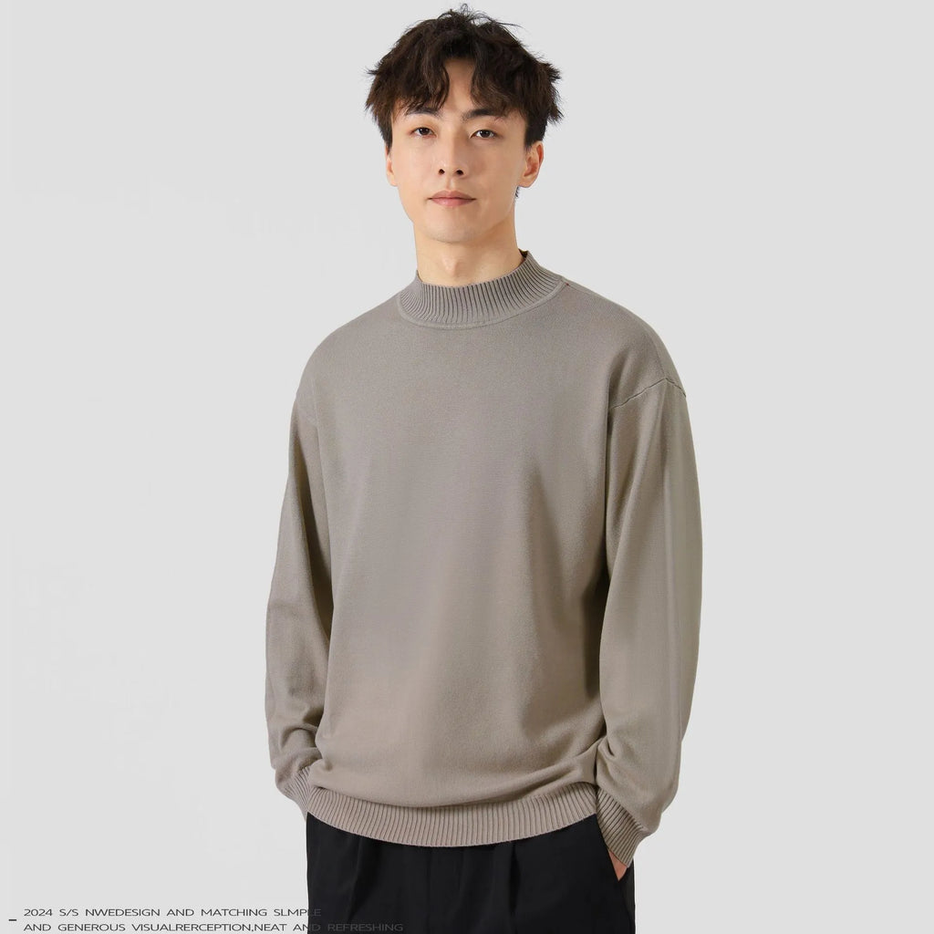 Men's loose fit long sleeve pullover sweater in a neutral colour on a hanger