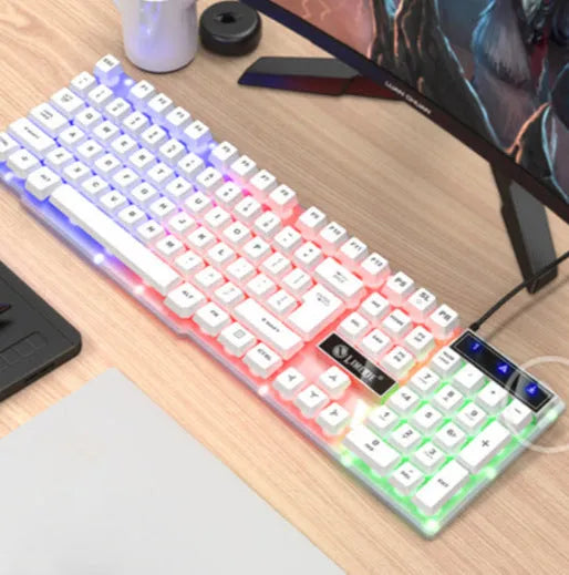 TX35 mechanical feeling keyboard in white colour with USB cable connected to laptop