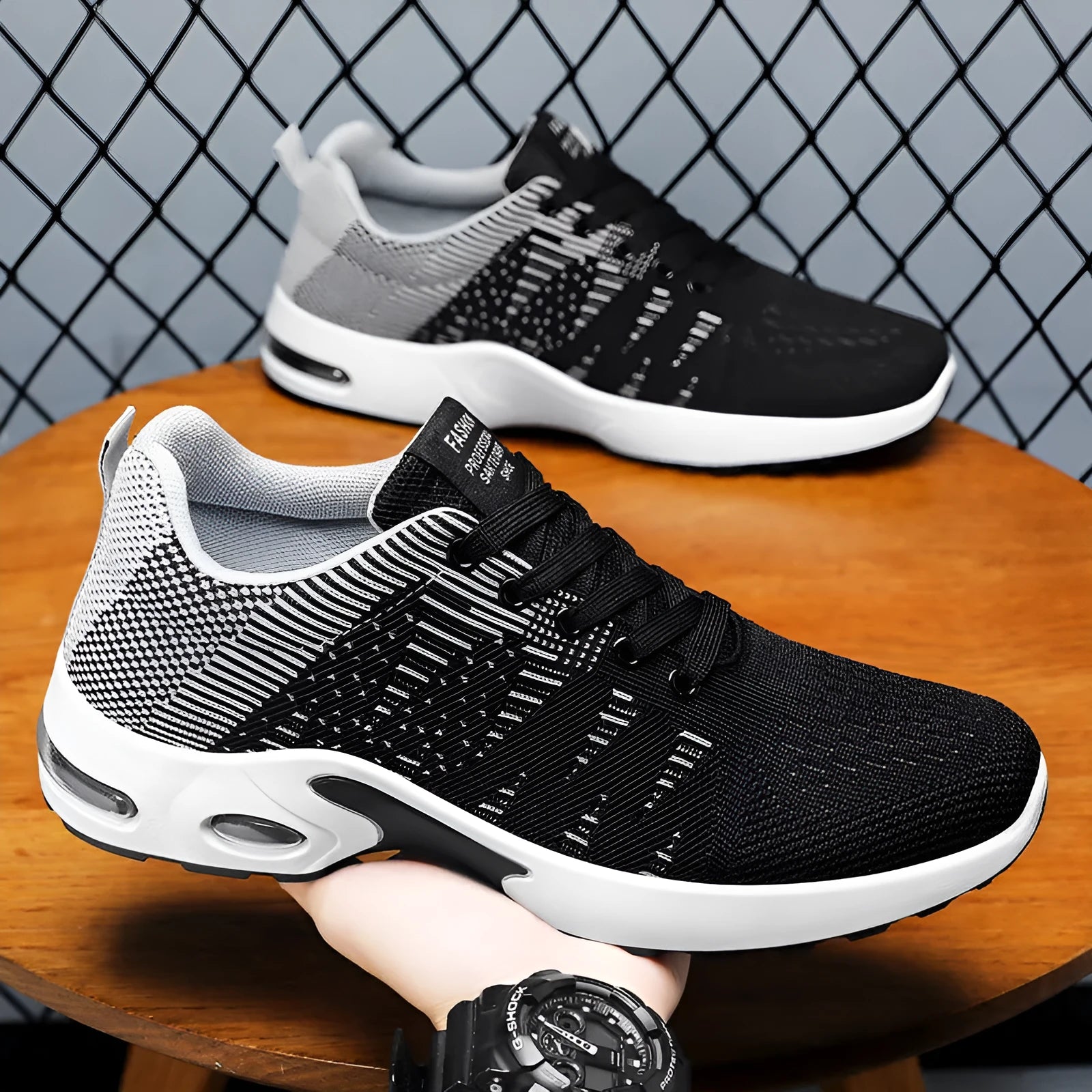 Men's low-top casual sneakers in black and blue with Flyknit mesh upper and lace-up front.