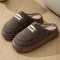Men's brown and grey suede slippers with a thickened sole, shown from the side.