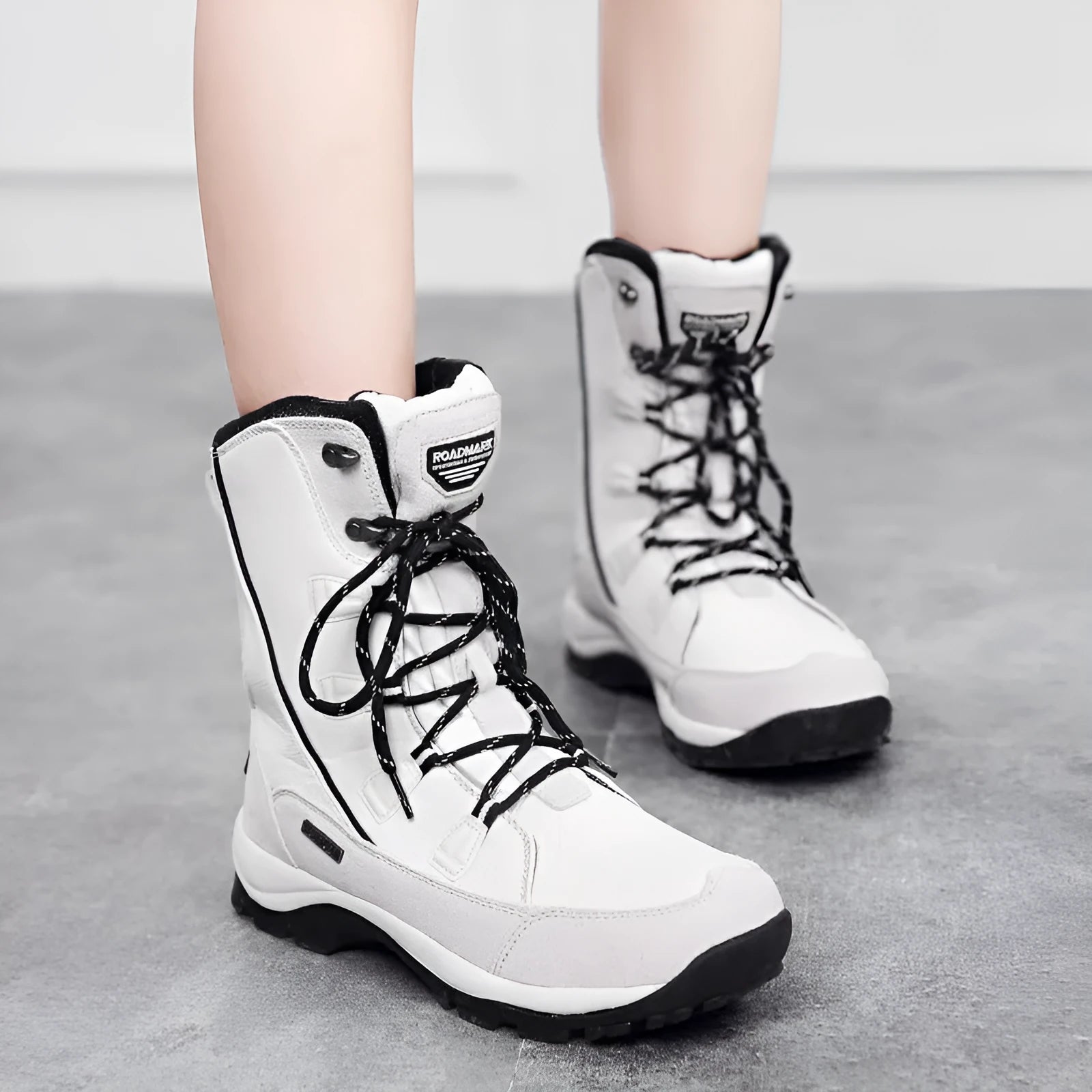 Women's black genuine leather mid-calf snow boots with a round toe and rubber sole.