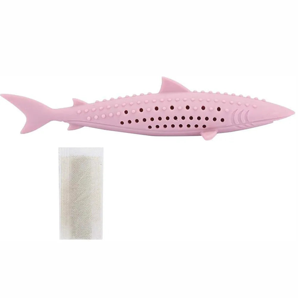 Green silicone fish-shaped cat chew toy with side holes on a white background