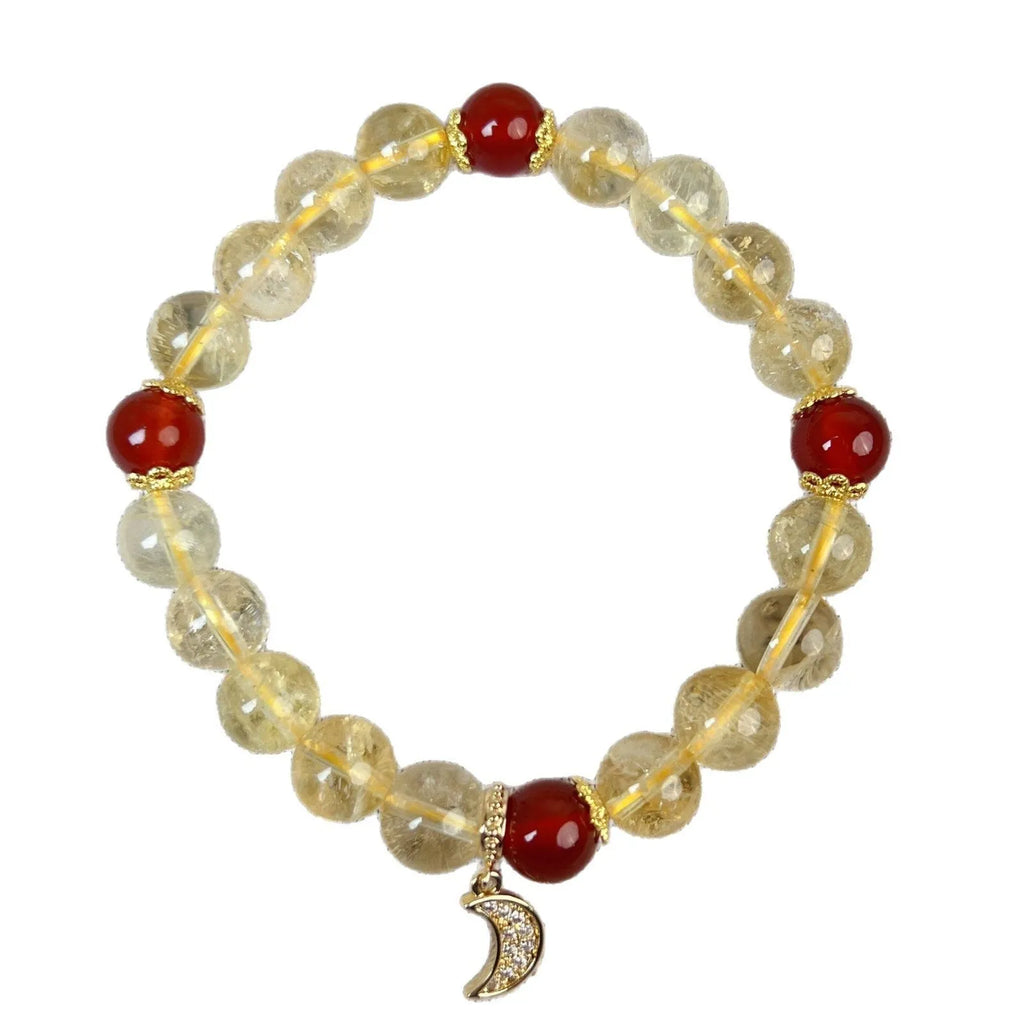 Citrine and red agate crystal moon boom bracelet for women on a white background.