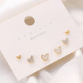 Women's heart shape earrings suit with three pairs in gold, black, black white, and pink colours