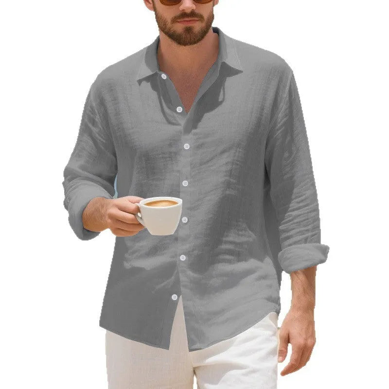 A man's loose-fitting casual linen shirt in a light colour, showcasing the non-iron style.