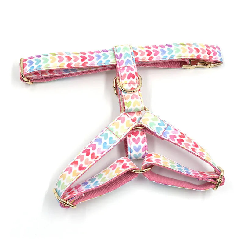 Pink colourful dog harness with gold buckle and heart-shaped stone decoration