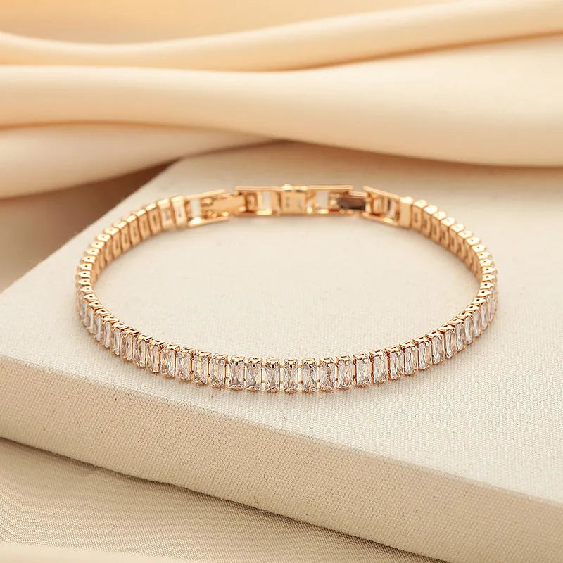 Rectangular brass women's bracelet with diamond zircon treatment in champagne gold colour