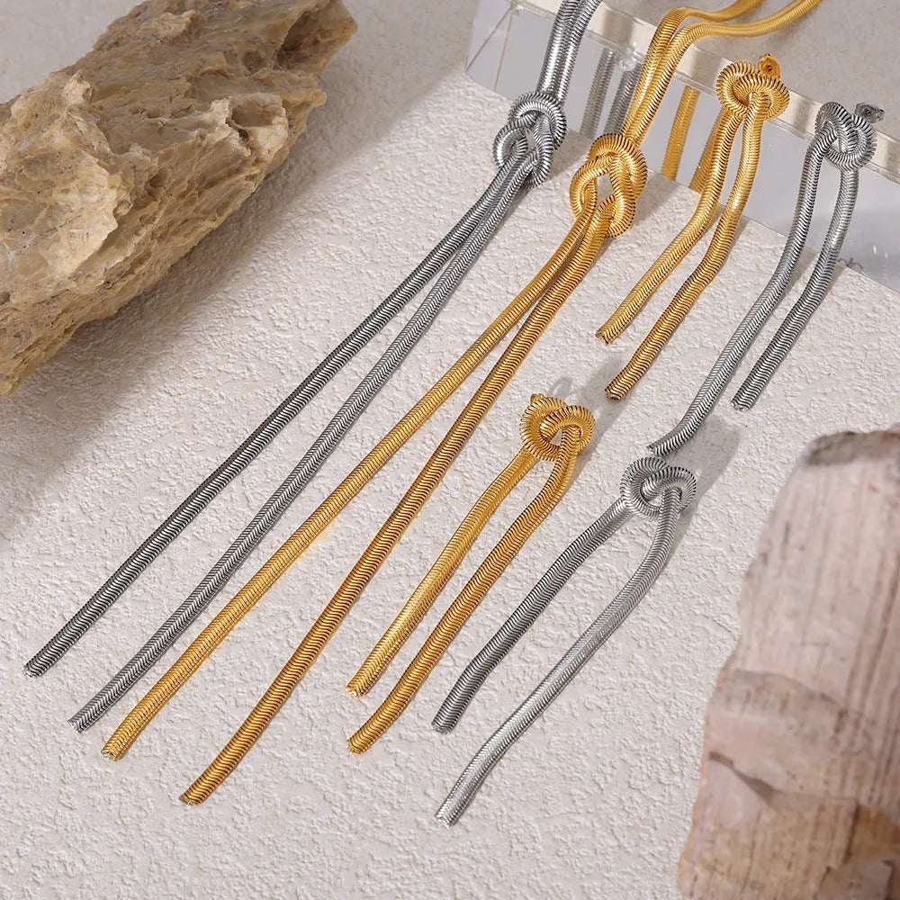 Gold-plated titanium steel necklace with knotted tassel pendant and matching earrings