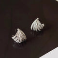 A pair of platinum-coloured geometric line design zircon earrings.