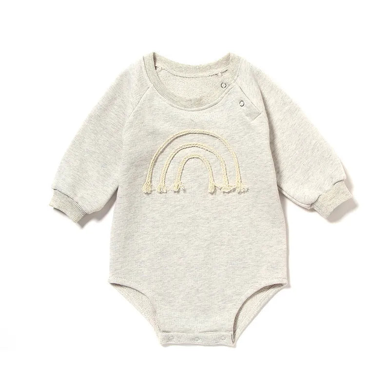 Long sleeve waffle cotton baby romper in neutral colour on hanger