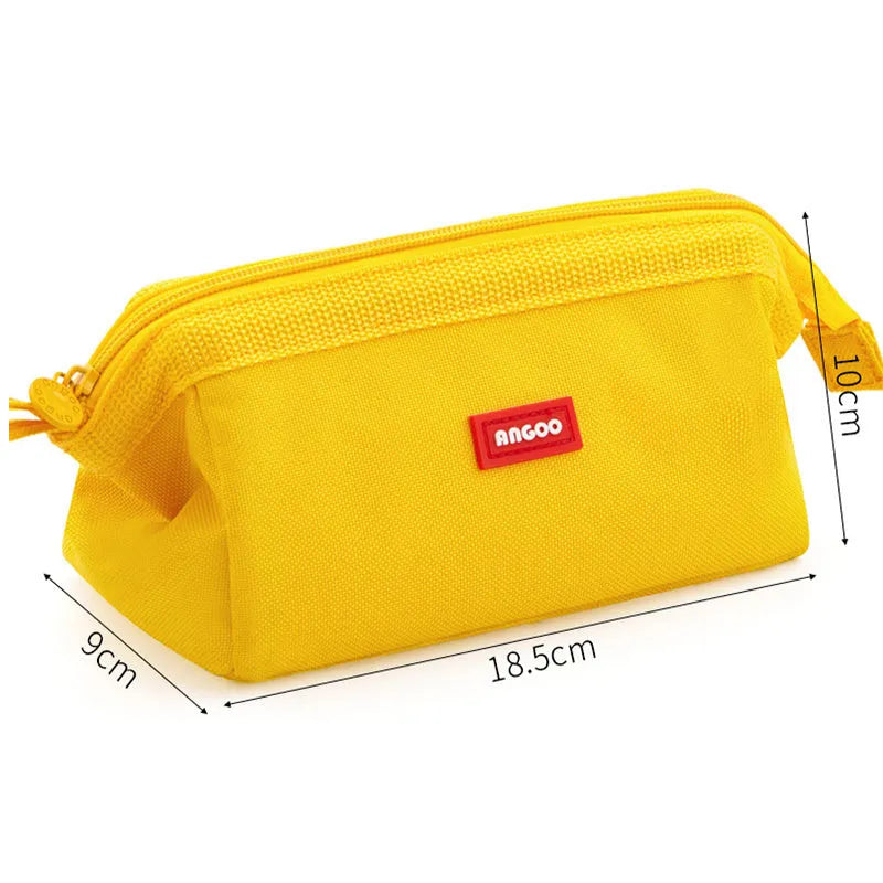 Large canvas pencil case with double zipper open, showing spacious interior for pens and pencils, in yellow colour.