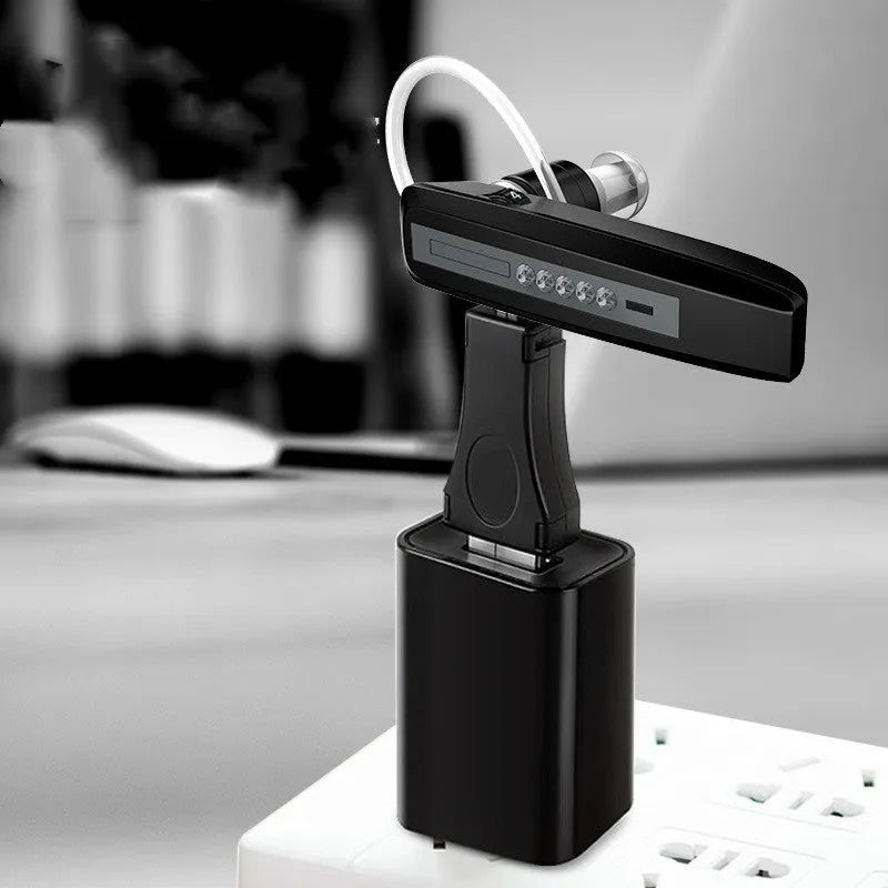 Black wireless invisible hearing aid with silicone shell and USB charging cable