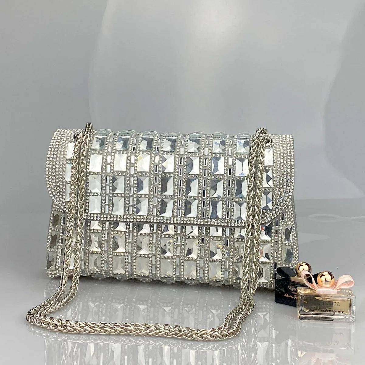 Shiny glass rhinestone chain clutch purse with diamond accents in horizontal square shape
