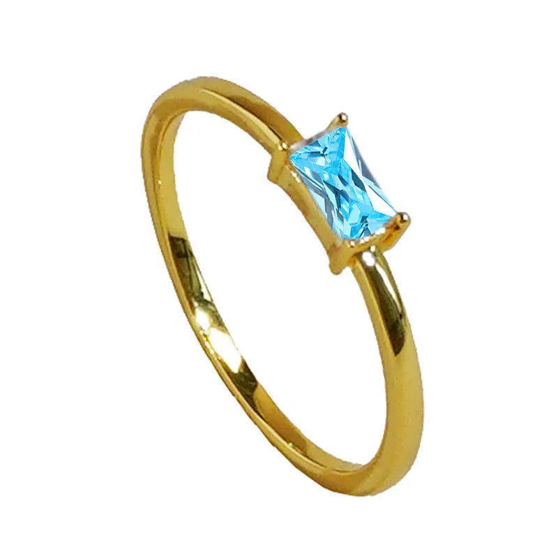 Sapphire blue geometric bracelet ring with zircon stones and heart-shaped elements on copper
