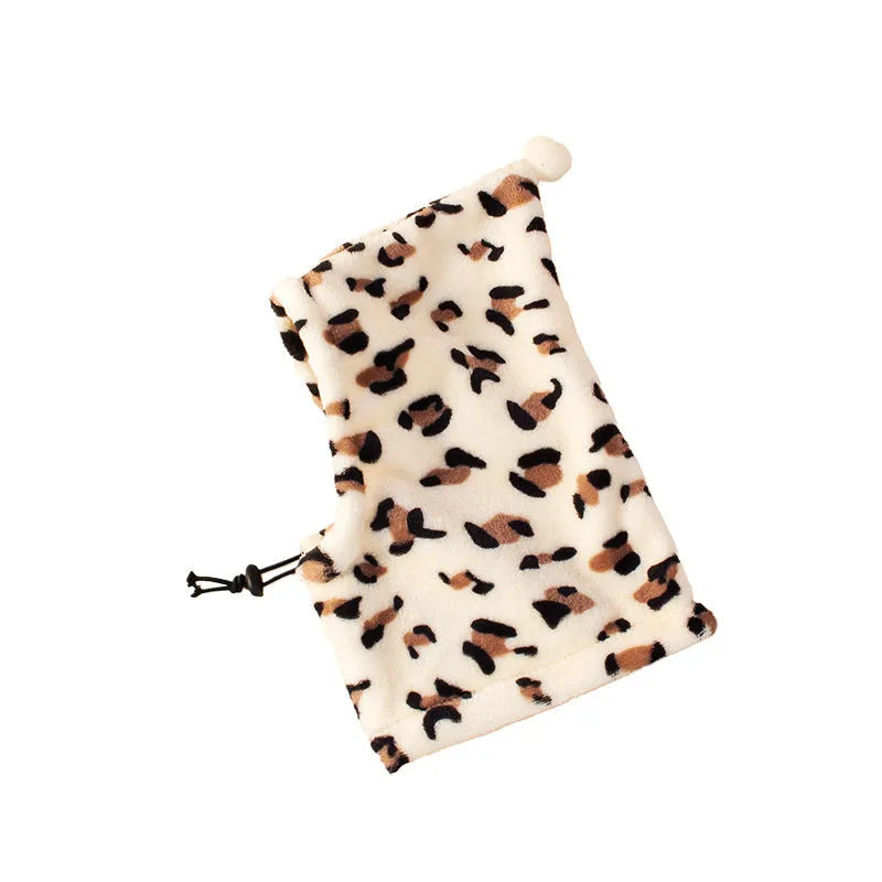 Cloth pet headgear with rabbit ears on a dog, in leopard print, with adjustable strap.