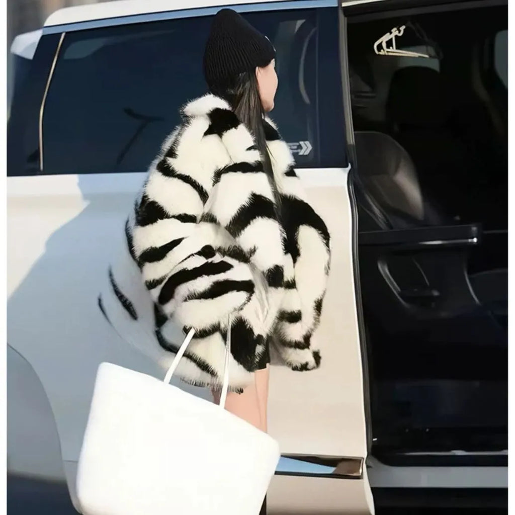 Women's zebra stripe fur top with skimmer collar and long sleeves