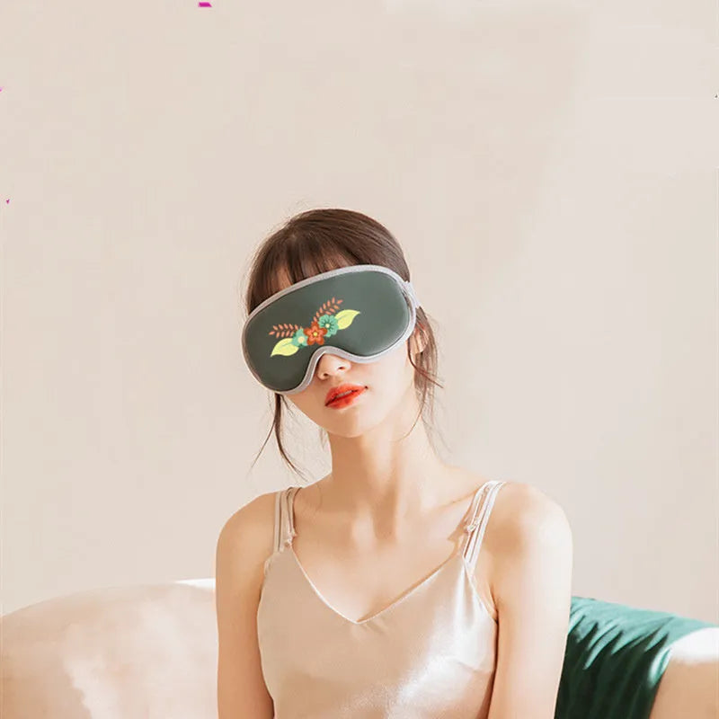 Pink and green portable USB steam sleep massage goggles for eye relaxation.