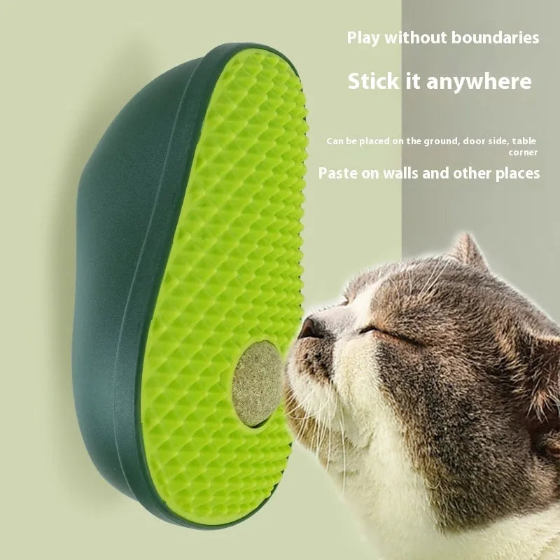 Green avocado-shaped cat scratching post toy on a plain background.