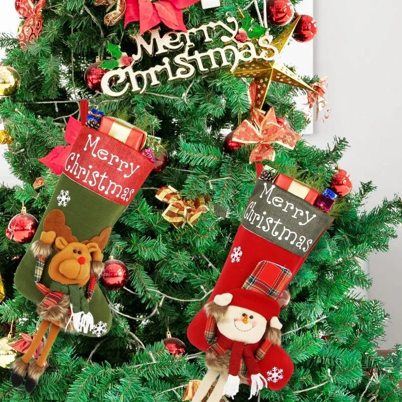 Three large Christmas stockings featuring Santa, Snowman and Reindeer designs with 3D applique decorations