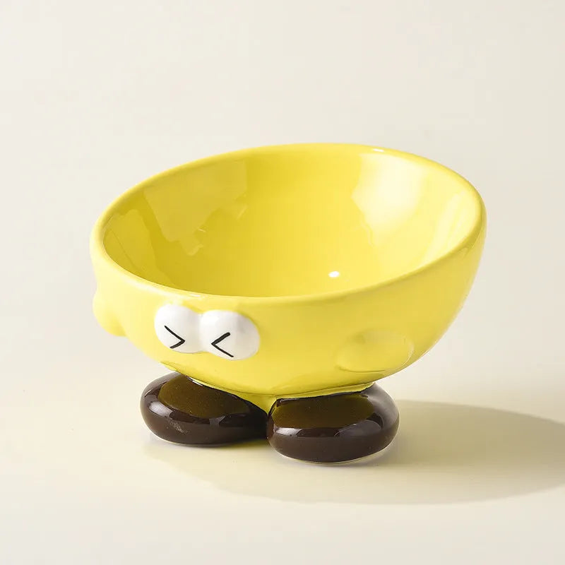 Blue ceramic oblique pet bowl with tall sides and a cute expression print for cervical spine support.