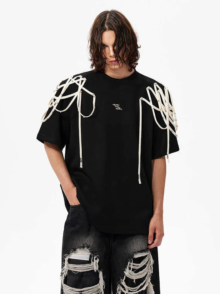 Black loose fit t-shirt with rivet ribbon detail on padded shoulders