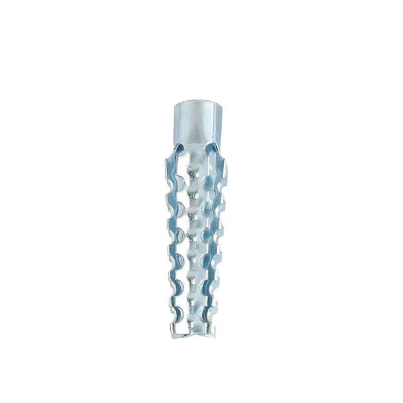 Close-up of metal expansion screw showing barbed serrations and iron construction.