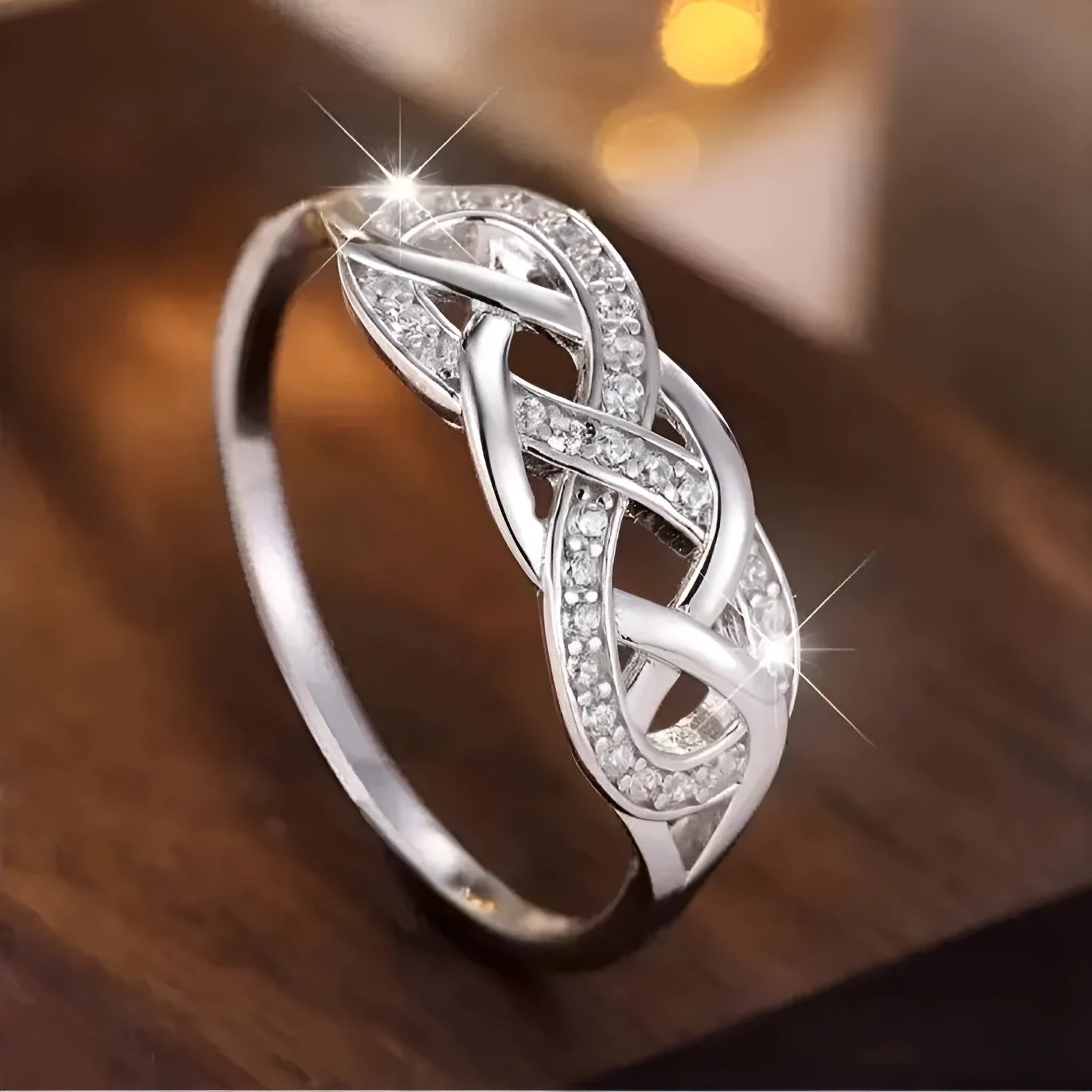 Multi-layer winding hollow geometric twist ring in white gold finish with inlaid zircon, copper base, sizes No 6 to No 10