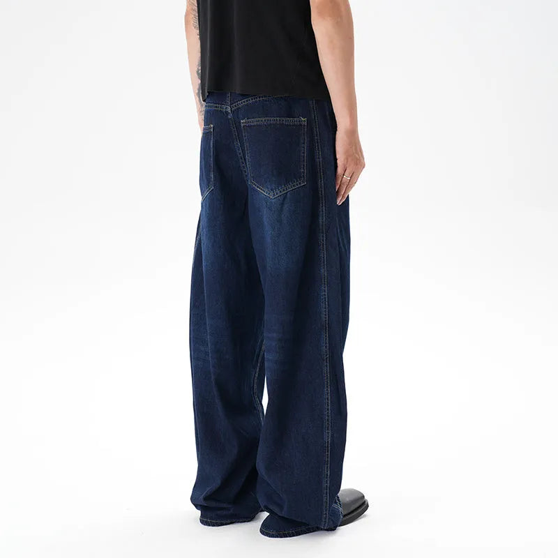 Dark blue women's wide-leg denim jeans with distressed detailing on the legs.