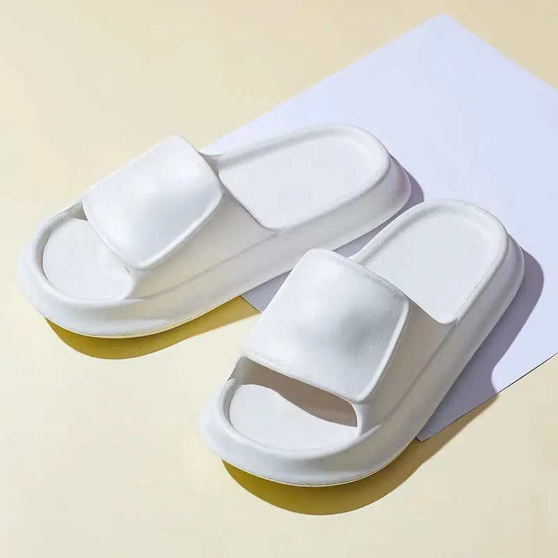 A pair of soft, thick-soled EVA flip-flop slippers in a chosen colour, showing the non-slip tread pattern on the sole.