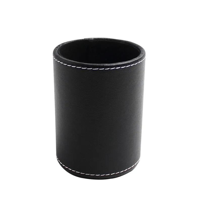 Small round black leather pen holder container showing cylindrical shape and compact dimensions