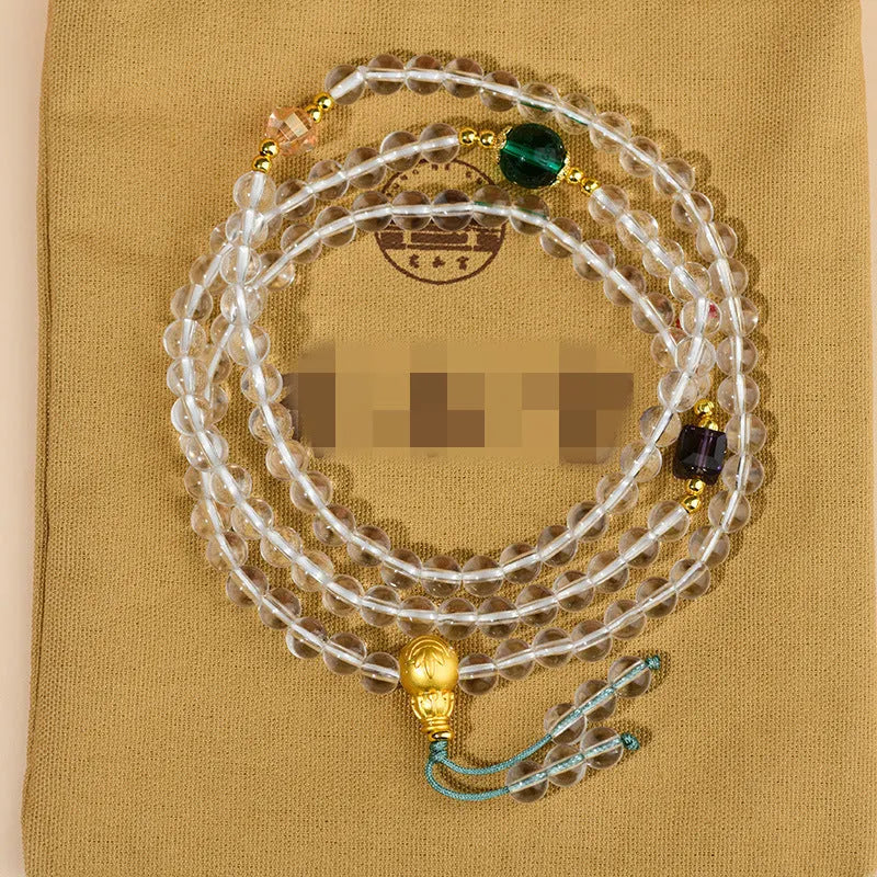 White crystal 108 bead geometric ethnic style bracelet necklace shown worn as both bracelet and necklace