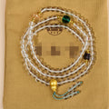 White crystal 108 bead geometric ethnic style bracelet necklace shown worn as both bracelet and necklace