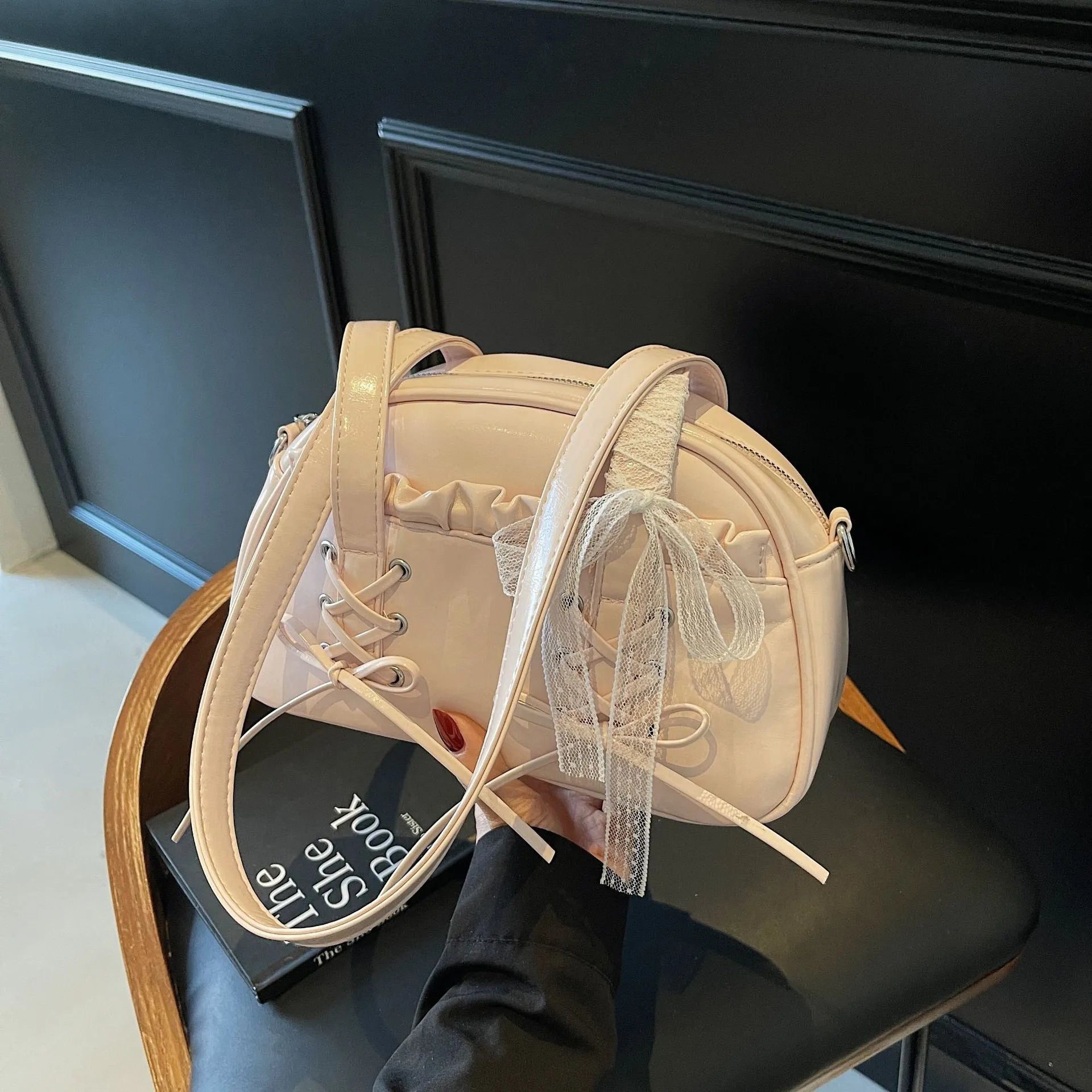 Women's casual PU leather shoulder handbag with a bandage bow detail, shown in beige colour.