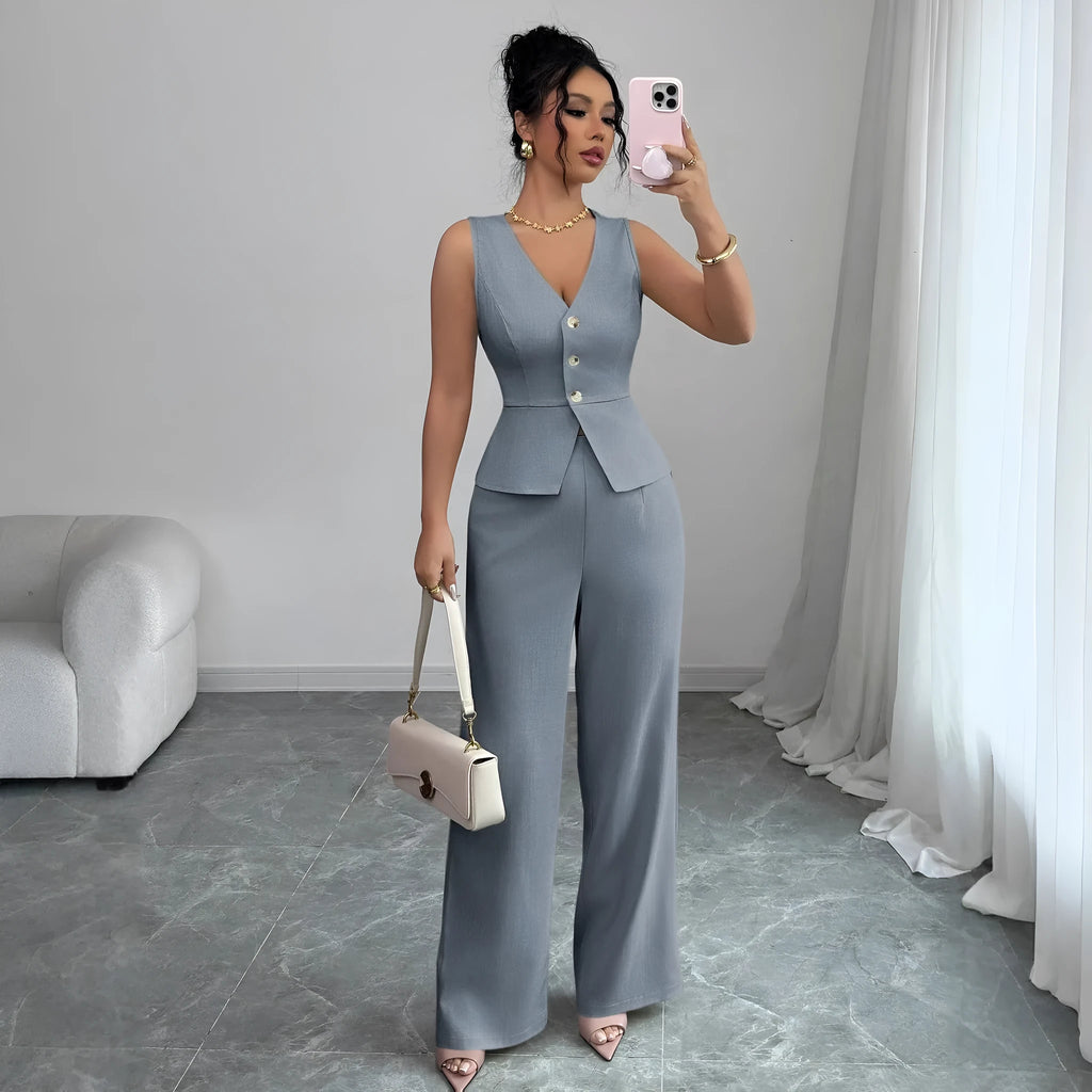 Women's solid colour sleeveless vest and high-waist trousers two-piece set in polyester fabric.