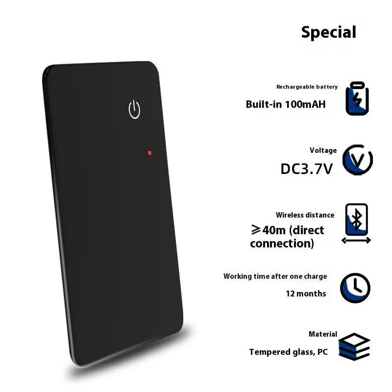 Black credit card-sized pet tracker with wireless charging and a hanging hole, shown next to a coin for scale.