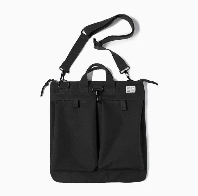 Military green canvas crossbody messenger bag with shoulder strap showing vertical square shape and zipper closure