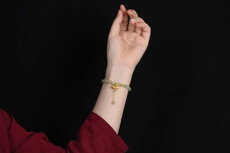 Shihuan natural Hetian jade bracelet with 6mm beads and a central fu character.