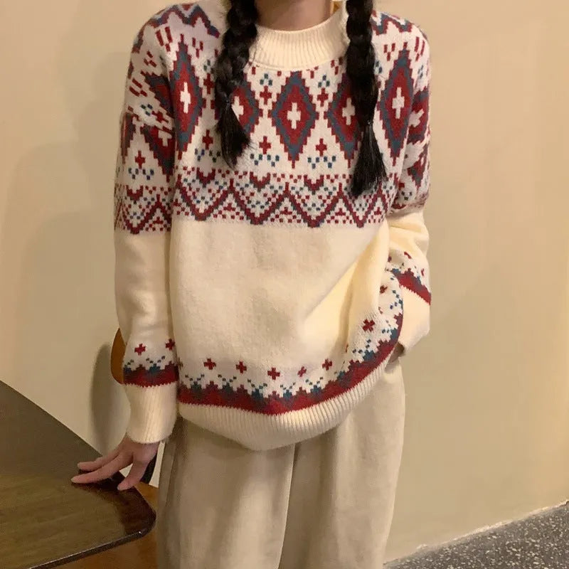 Red and white striped women's loose long-sleeve pullover knitted top on a hanger.