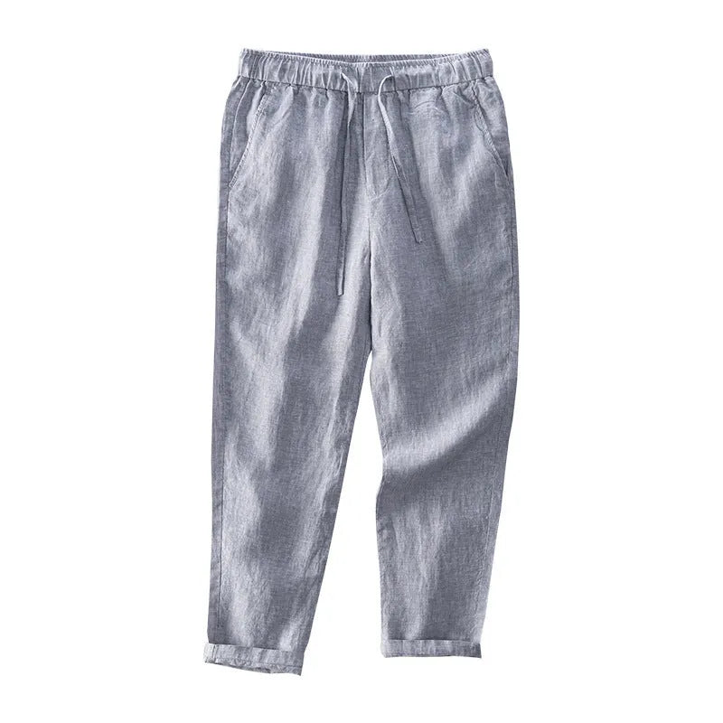 Men's linen straight leg trousers in light grey showing mid-waist design and straight cut