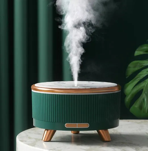 Cylinder plastic USB humidifier in black with 500ml tank and single fog outlet on a bedside table